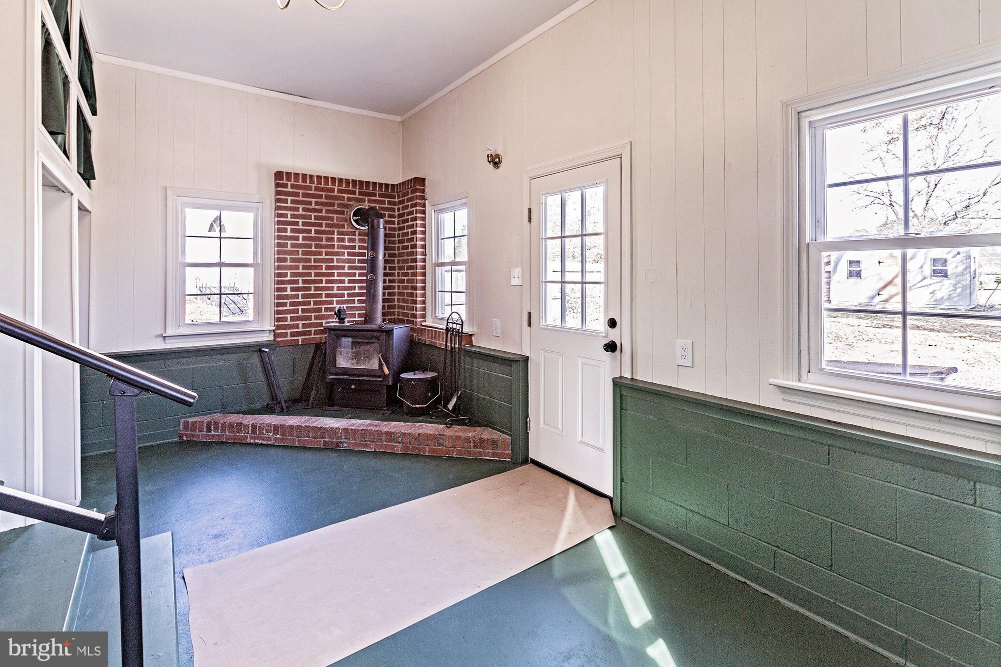 56 Main Street Hancocks Bridge, NJ 08038 - Photo 7 of 33 a view of a living room with furniture and a window
