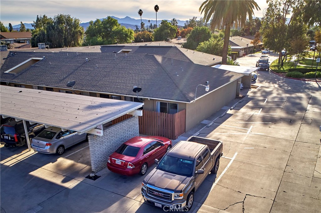 a view of a patio with table and chairs with wooden floor and fence