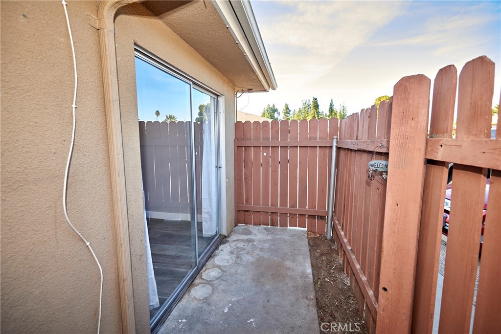 4723 Jackson Street, Unit 28 Riverside, CA 92503 - Photo 11 of 33 a view of a balcony with wooden fence
