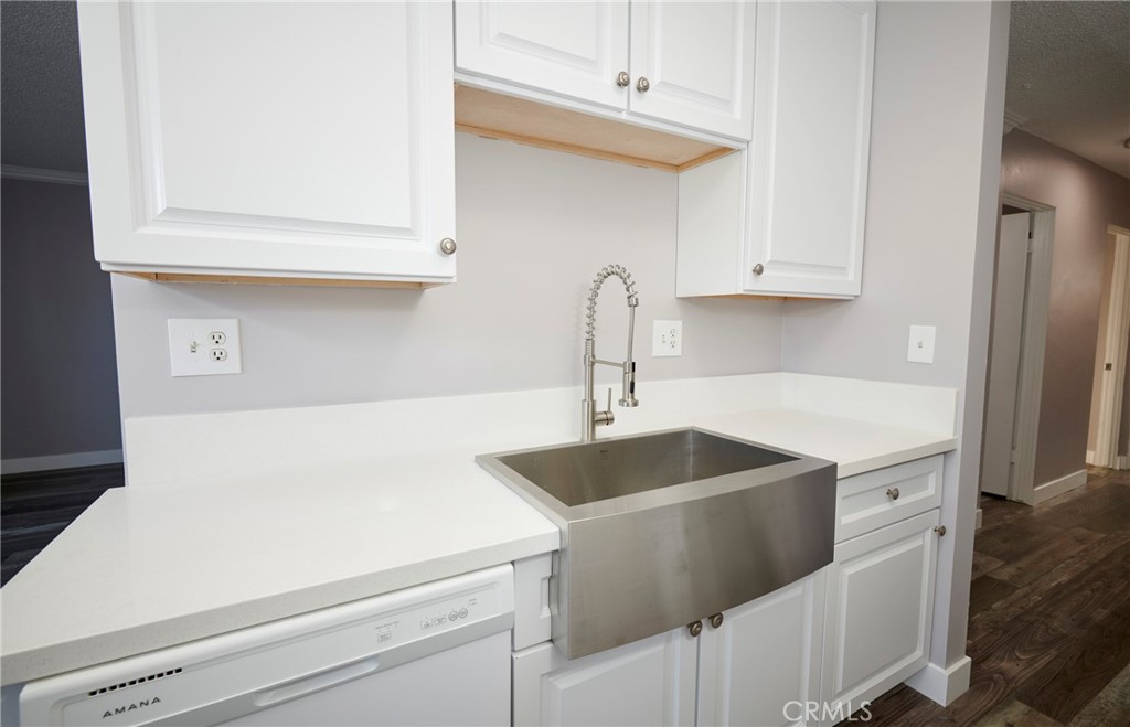 4723 Jackson Street, Unit 28 Riverside, CA 92503 - Photo 19 of 33 a kitchen with a sink and cabinets