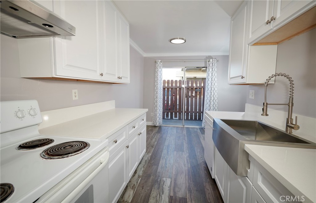 4723 Jackson Street, Unit 28 Riverside, CA 92503 - Photo 20 of 33 a kitchen with a stove and a sink