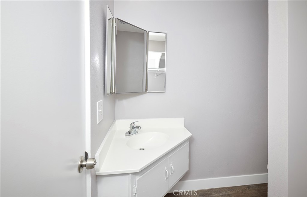 4723 Jackson Street, Unit 28 Riverside, CA 92503 - Photo 28 of 33 a bathroom with a sink and a mirror