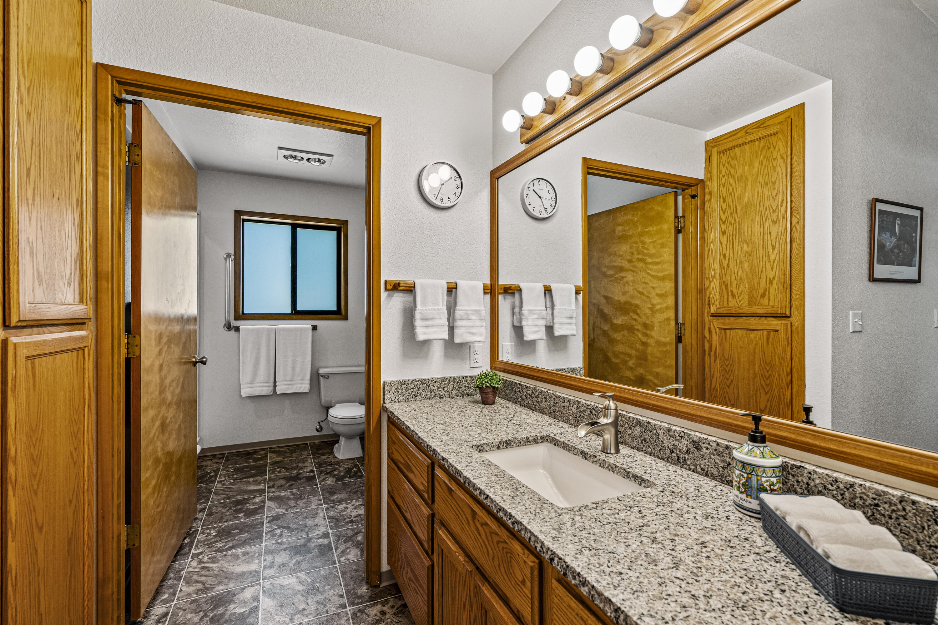 11744 Galice Road Merlin, OR 97532 - Photo 39 of 74 a bathroom with a granite countertop double vanity sink and a mirror