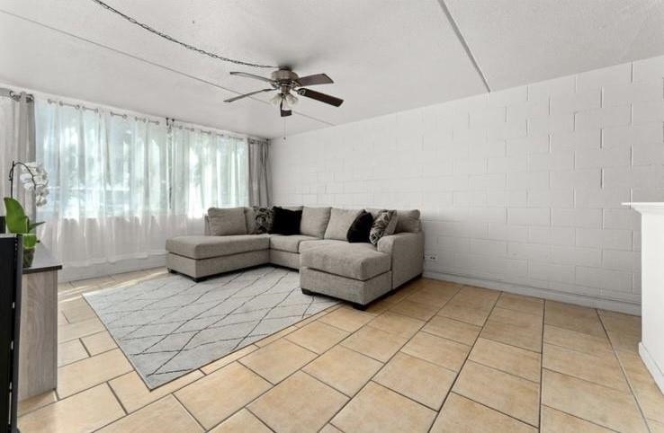 111 Kahului Beach Road, Unit B112 Kahului, HI 96732 - Photo 5 of 15 a living room with furniture and a rug