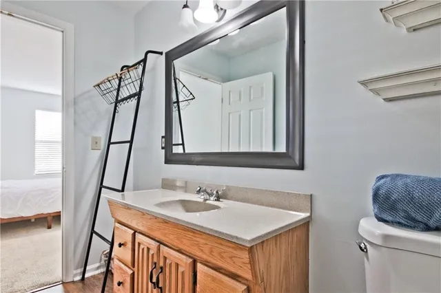 a bathroom with a sink vanity granite and a mirror