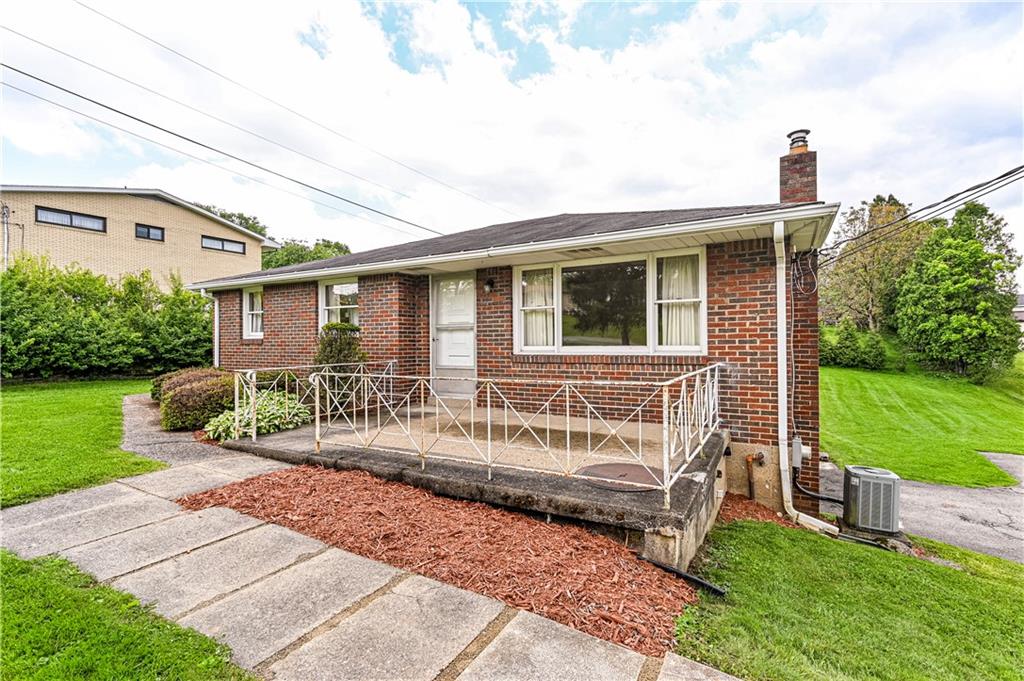 13740 Ridge Road Irwin, PA 15642 - Photo 2 of 43 a view of a house with a yard and sitting area