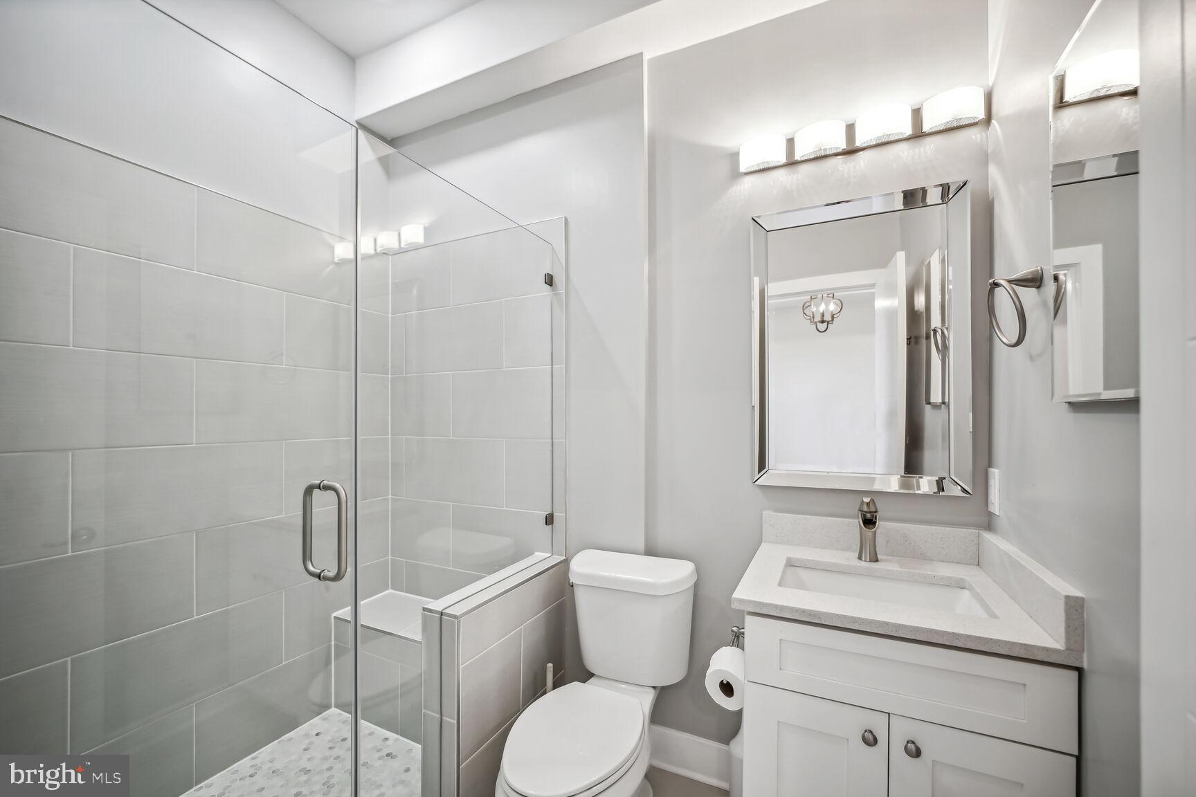 2012 D Street Northeast, Unit 3 Washington, DC 20002 - Photo 11 of 20 a bathroom with a sink toilet and shower