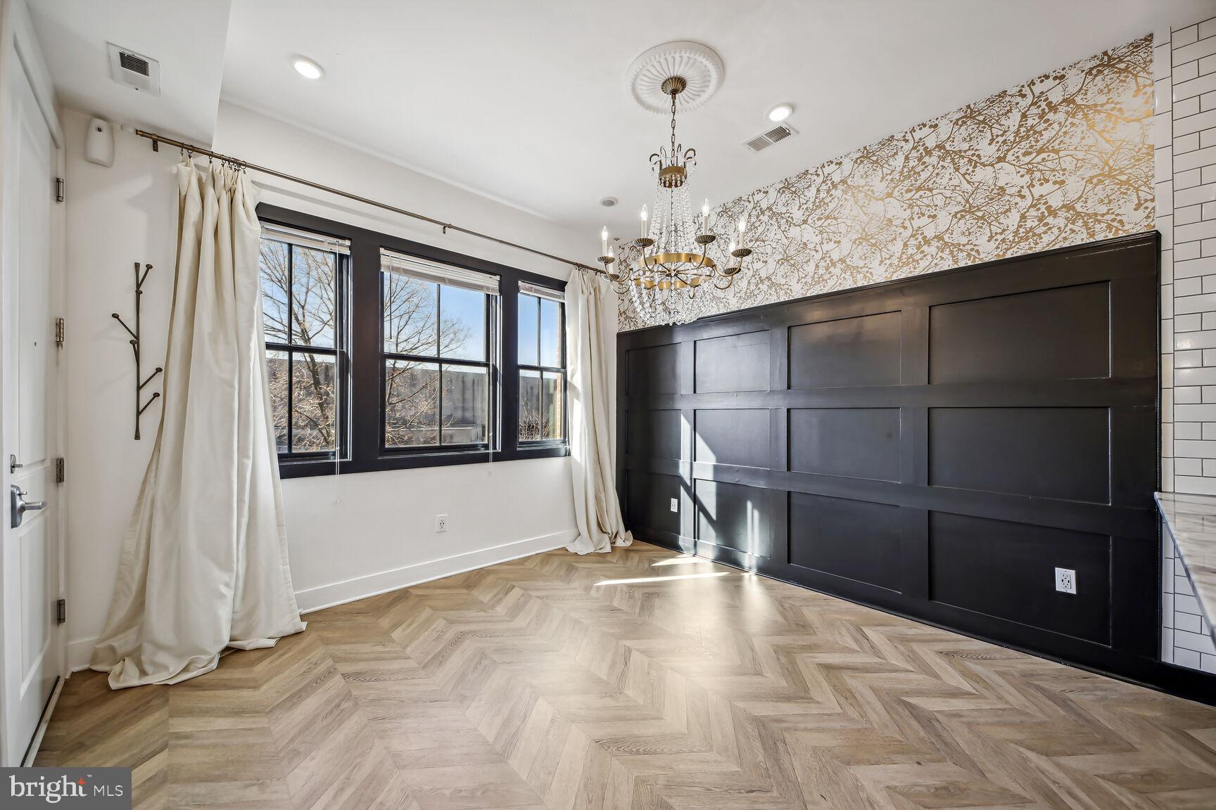 2012 D Street Northeast, Unit 3 Washington, DC 20002 - Photo 3 of 20 a view of an empty room with a fireplace