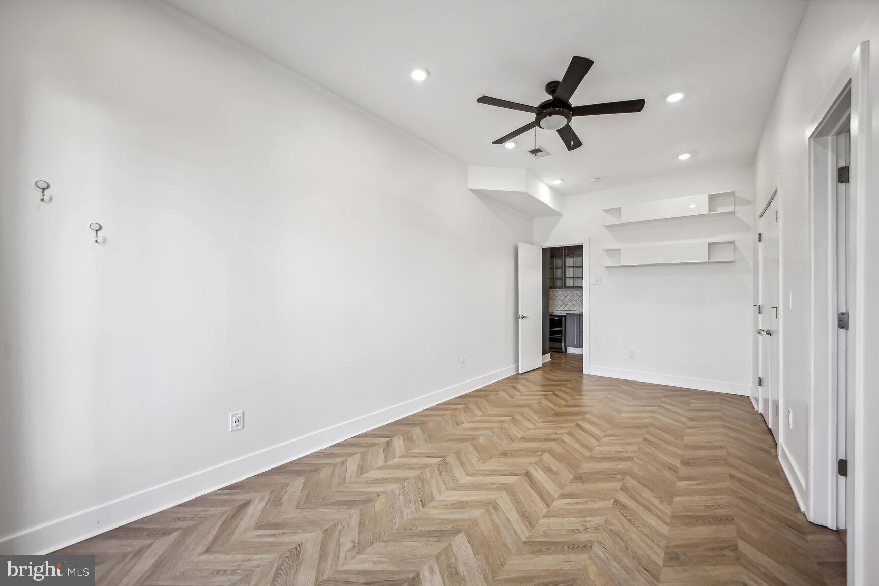 2012 D Street Northeast, Unit 3 Washington, DC 20002 - Photo 8 of 20 an empty room with closet and ceiling fan