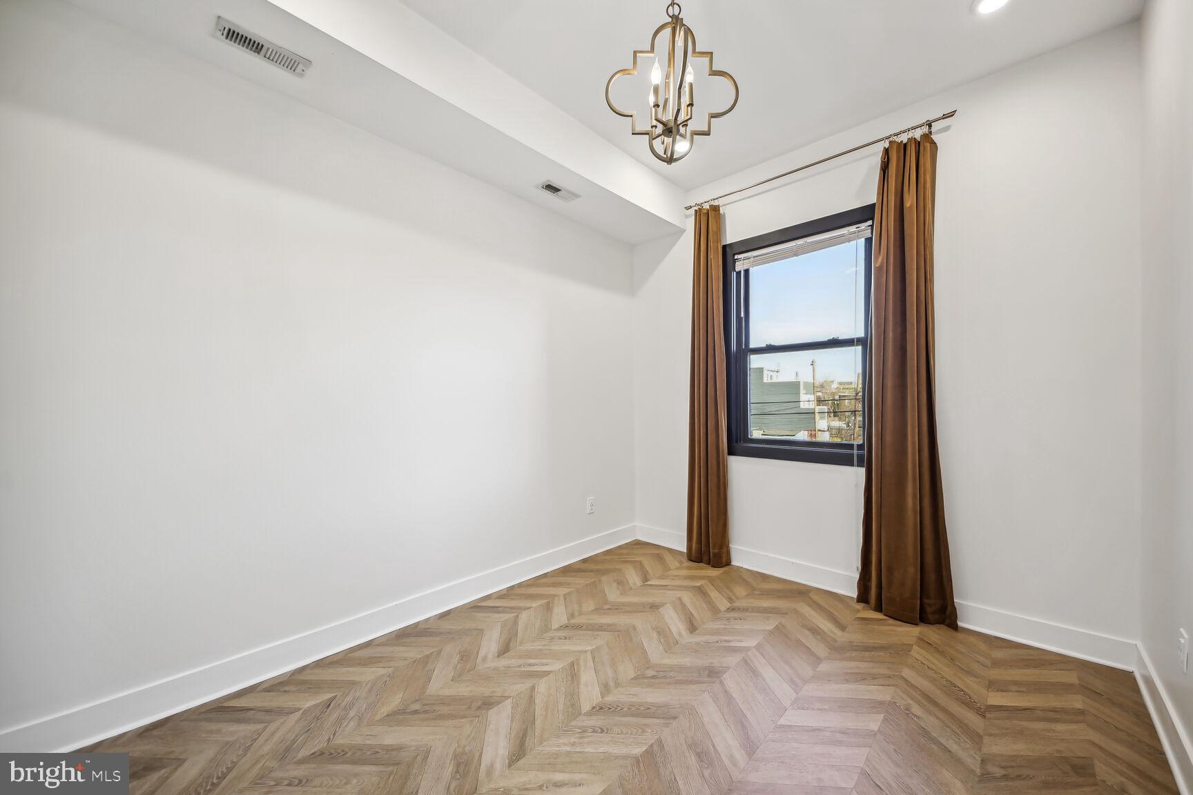 2012 D Street Northeast, Unit 3 Washington, DC 20002 - Photo 10 of 20 a view of a hallway with a chandelier