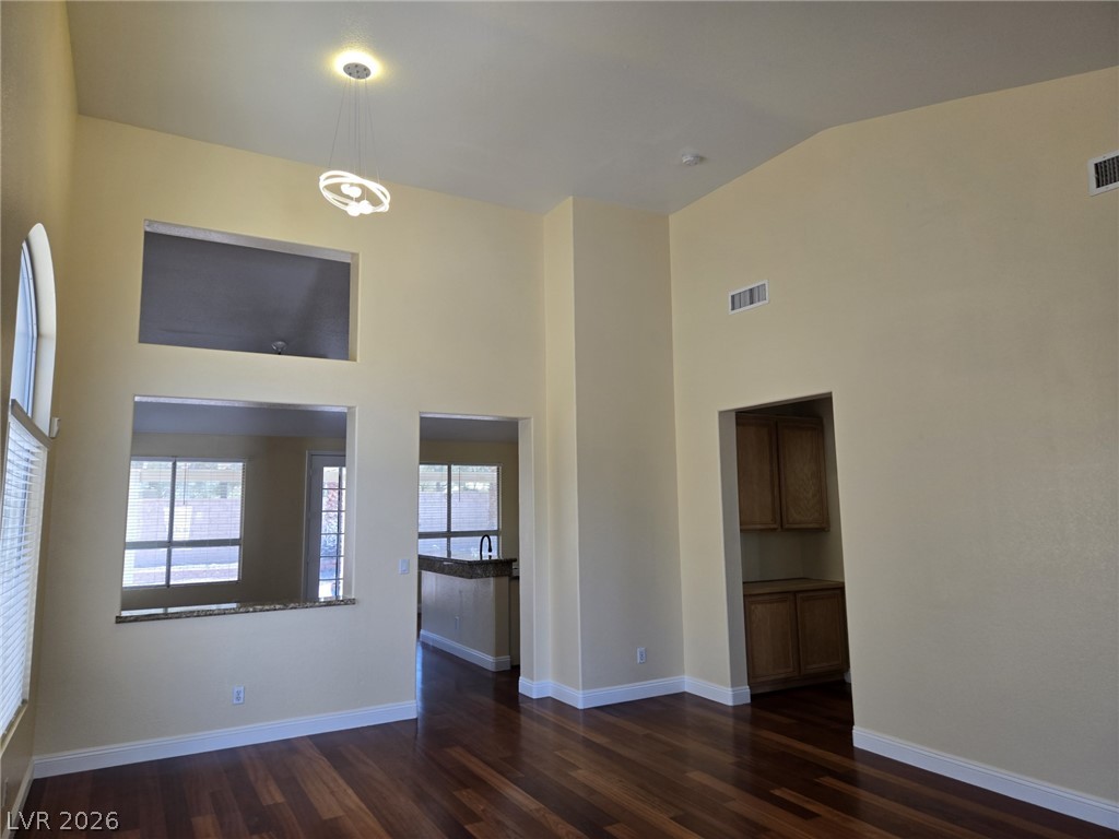 8417 San Ramon Drive Las Vegas, NV 89147 - Photo 4 of 33 Rich hardwood flooring complements soaring ceilings and an open-concept design.