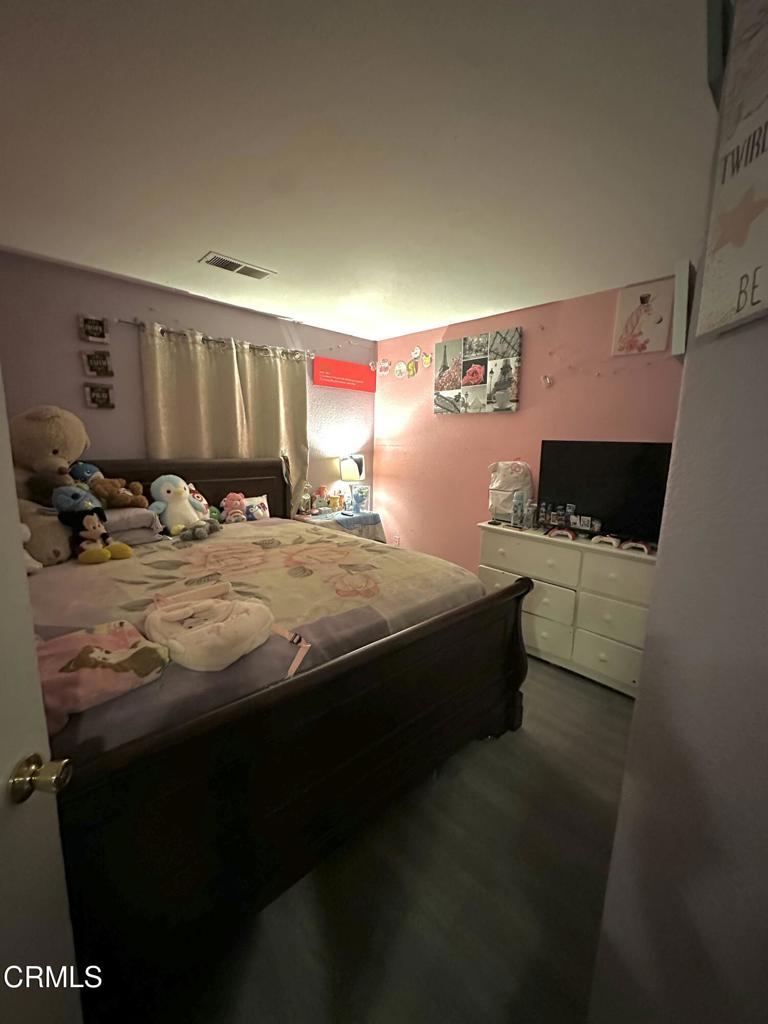 40339 Pantano Road Palmdale, CA 93550 - Photo 4 of 11 a bedroom with a bed and dresser