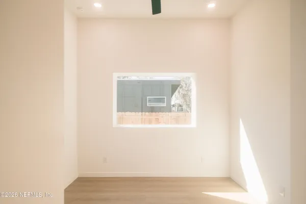 a bathroom with a shower and toilet