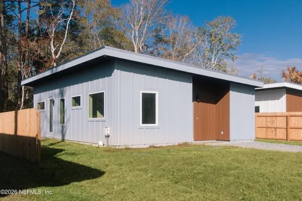 a backyard of a house with lots of green space