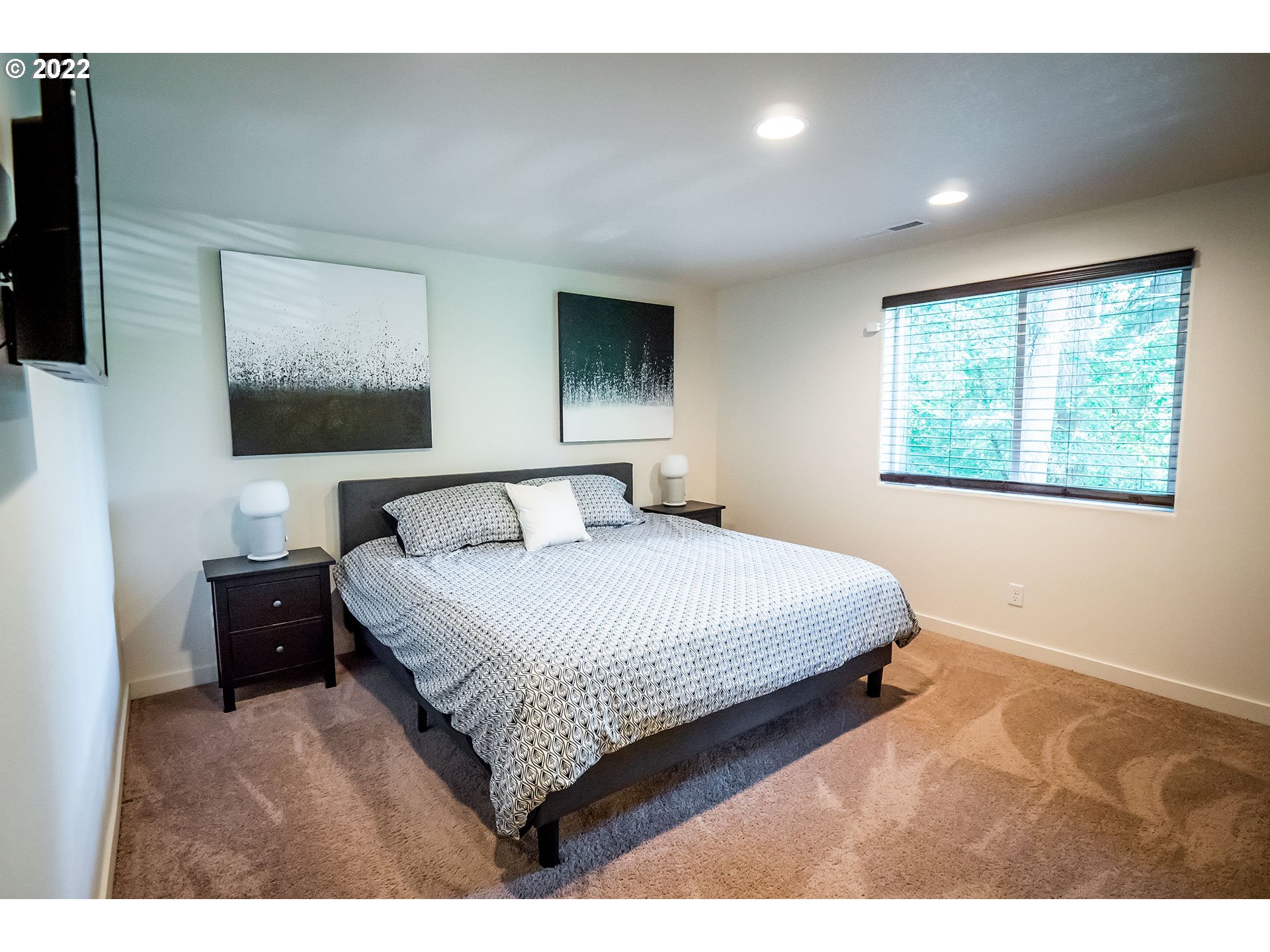 1345 Skyline Park Loop Eugene, OR 97405 - Photo 14 of 31 a bedroom with a large bed and a tv