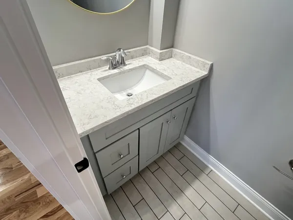 a bathroom with a sink and a mirror
