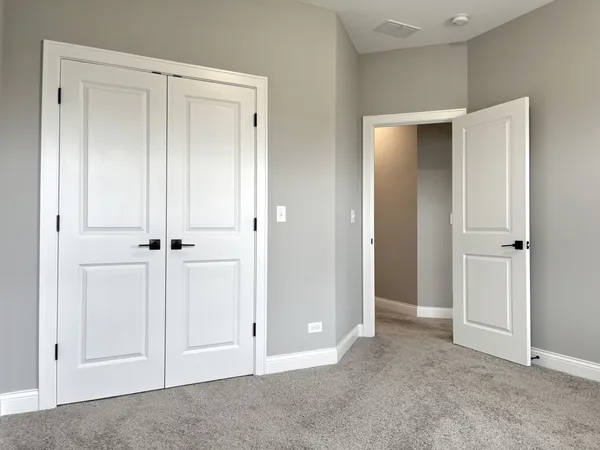 an empty room with closet area