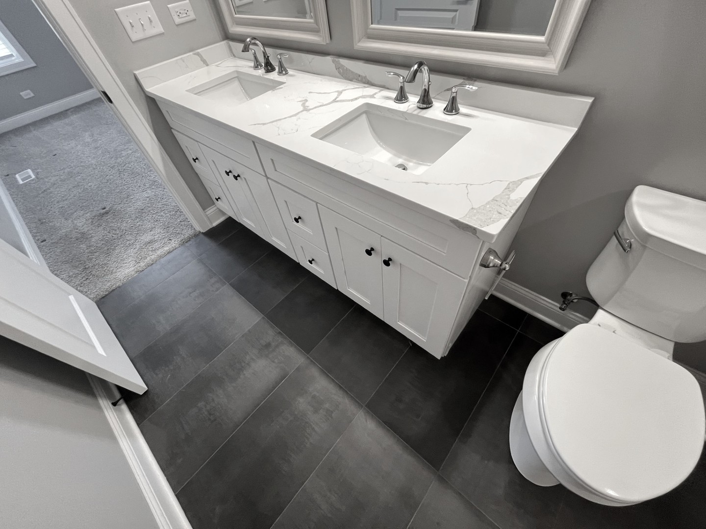 994 Center Drive Marengo, IL 60152 - Photo 10 of 23 a bathroom with a double vanity sink mirror and toilet