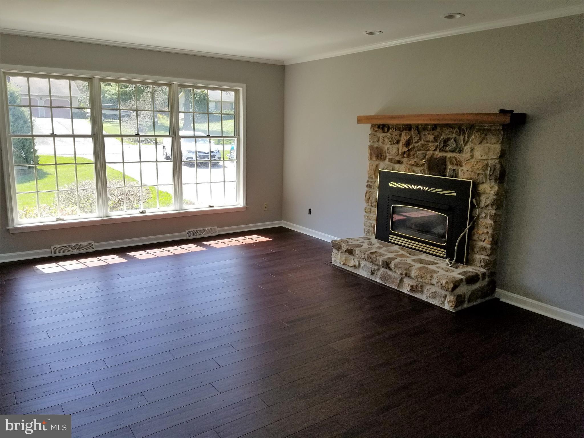 Hardwood floors and large windows