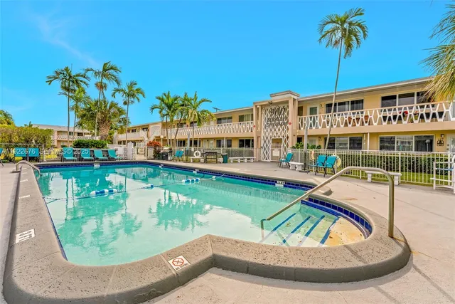 a view of a swimming pool with a lounge chairs