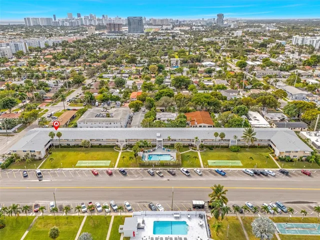 an aerial view of residential houses with swimming pool