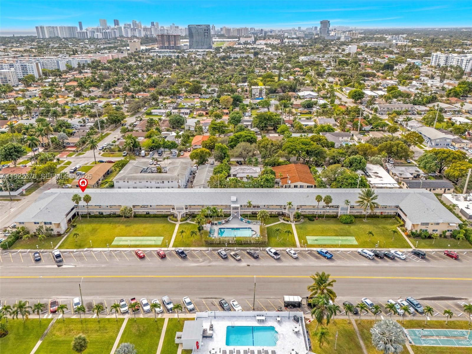 900 Atlantic Shores Boulevard, Unit 105 Hallandale Beach, FL 33009 - Photo 18 of 22 an aerial view of residential houses with swimming pool