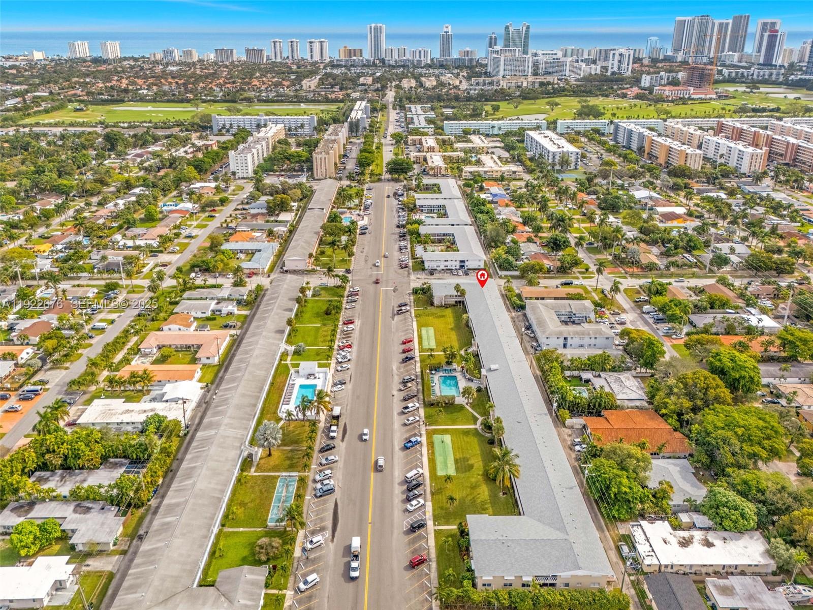 900 Atlantic Shores Boulevard, Unit 105 Hallandale Beach, FL 33009 - Photo 20 of 22 an aerial view of residential houses with outdoor space
