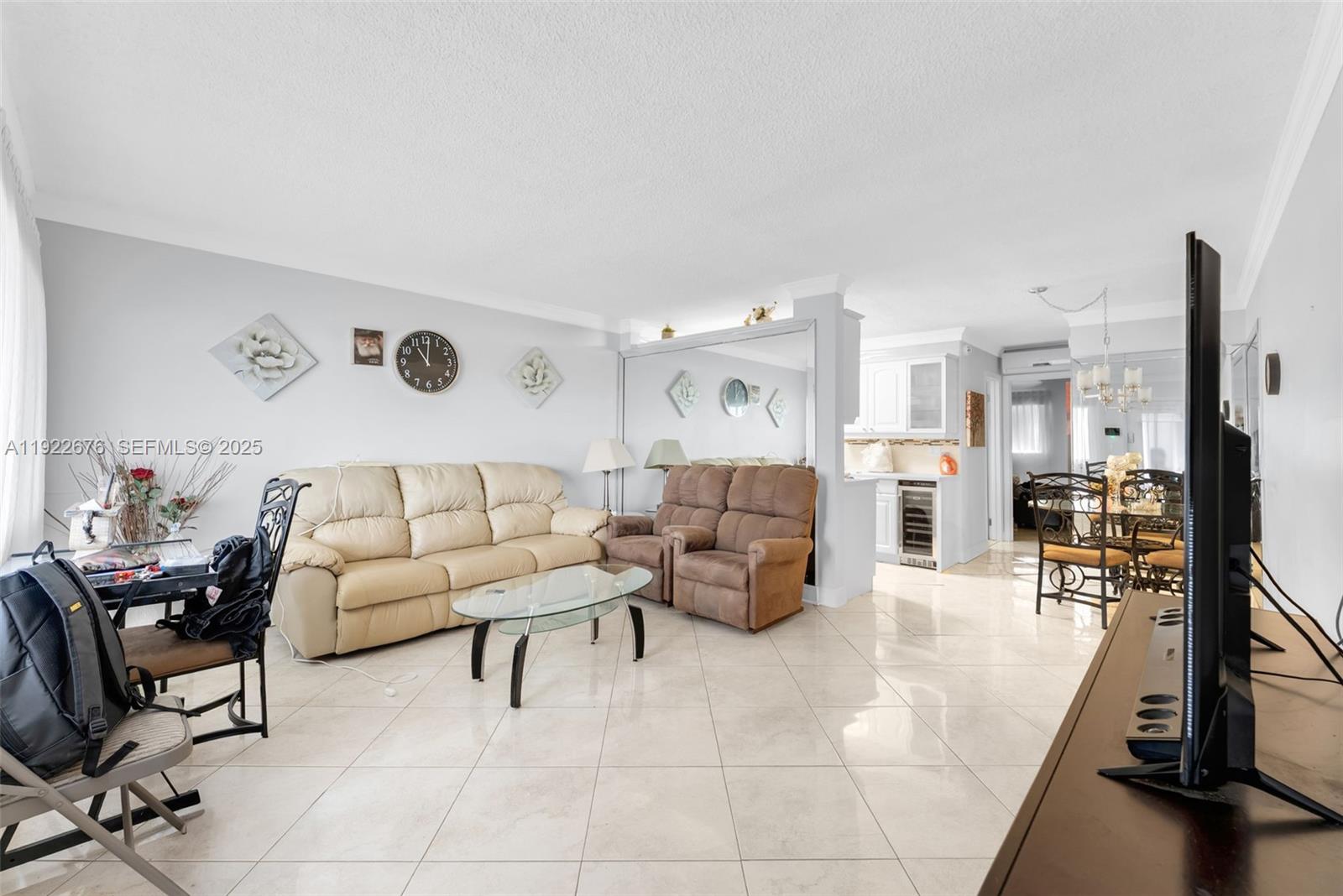 900 Atlantic Shores Boulevard, Unit 105 Hallandale Beach, FL 33009 - Photo 7 of 22 a living room with furniture