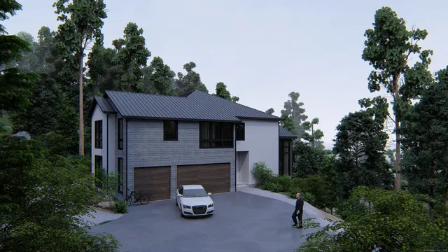 a view of a house with patio and a garden