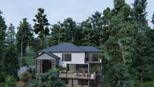 an aerial view of a house with yard porch and furniture