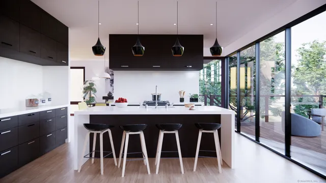 a kitchen with stainless steel appliances granite countertop a stove a refrigerator a sink and white cabinets with wooden floor