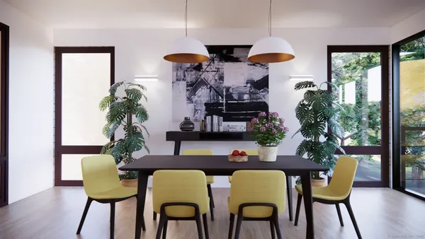 a view of a dining room with furniture wooden floor and chandelier