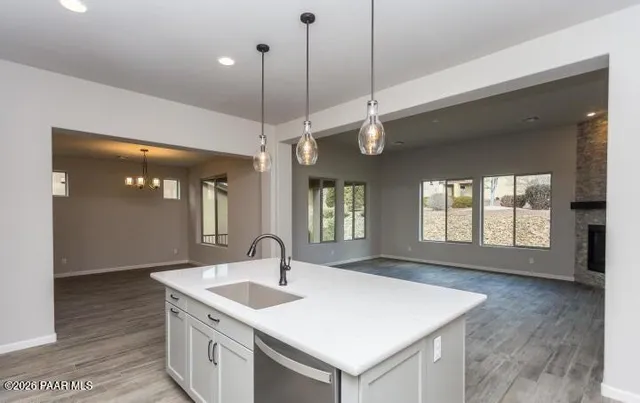 a view of a kitchen counter a sink and a window