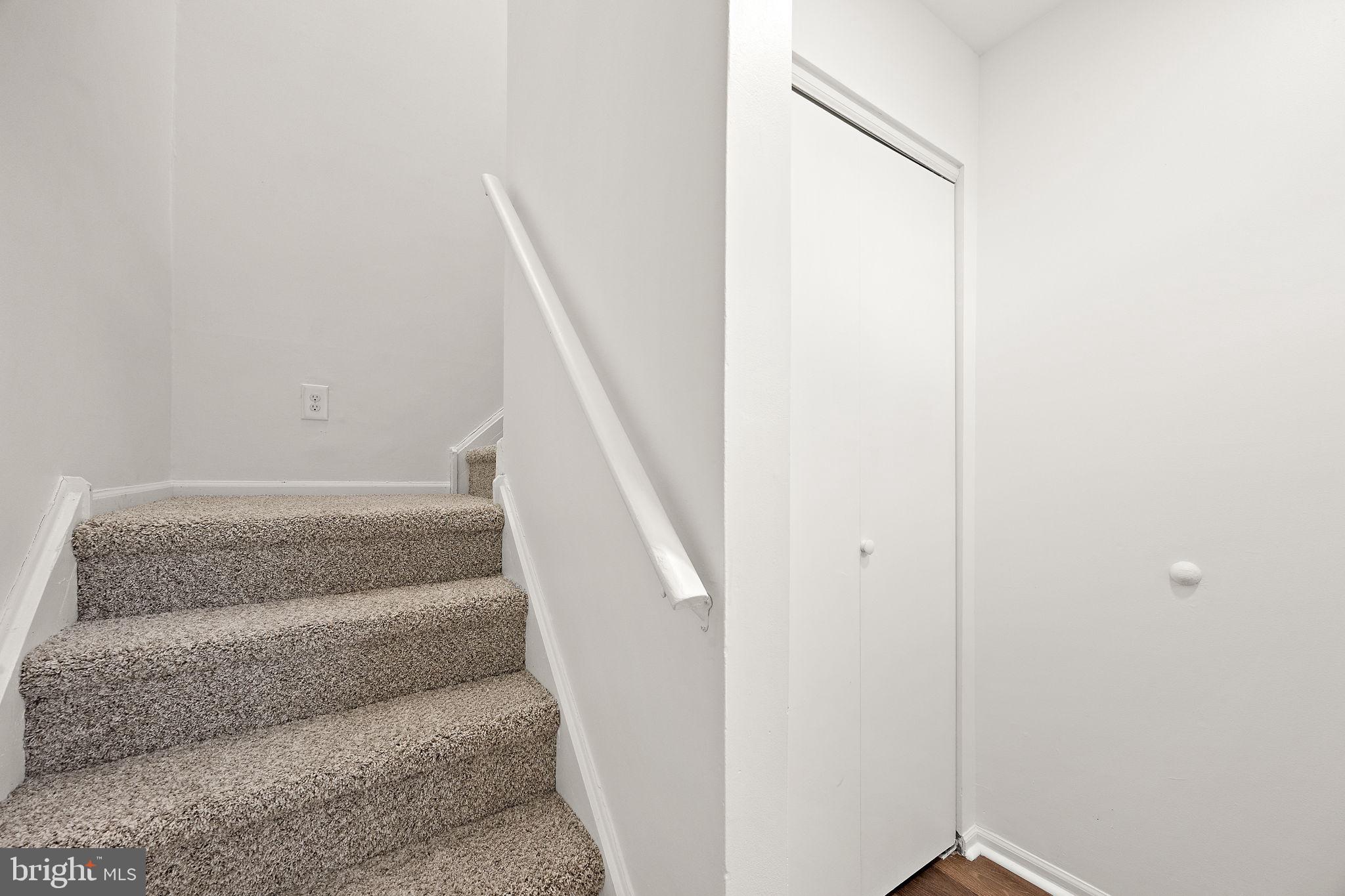 129 Emery Court, Unit A Newark, DE 19711 - Photo 2 of 15 a view of staircase with white walls