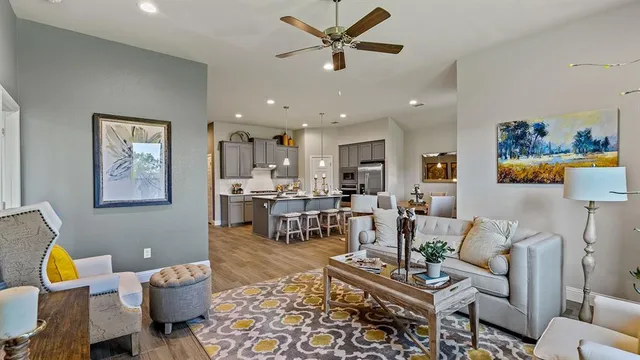 a living room with furniture and a large window