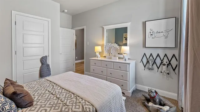 a view of a hallway with wooden floor and a cabinet