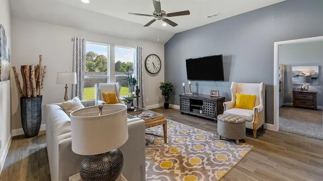 a dining room with furniture and wooden floor