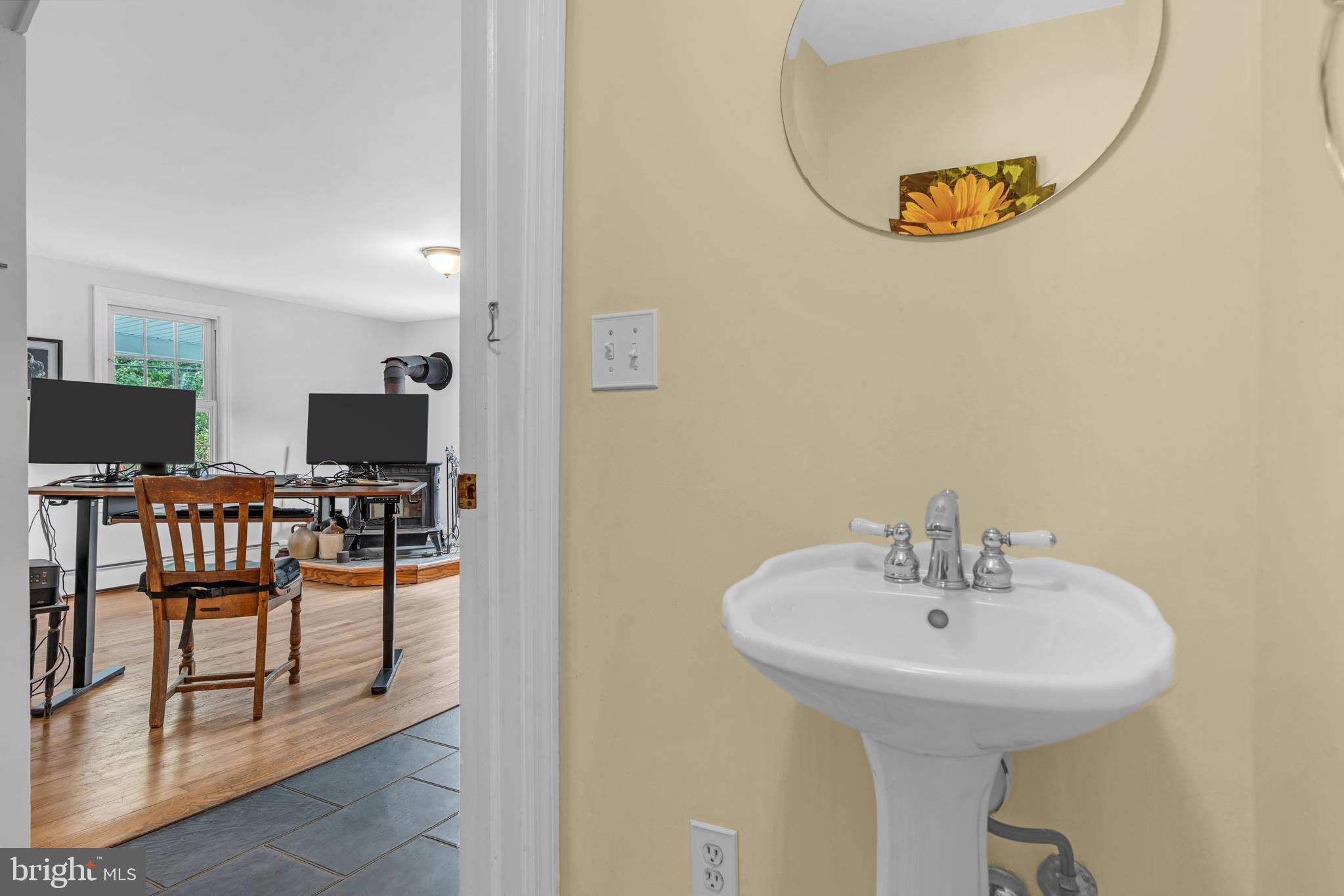 14 Maxim Road Howell, NJ 07731 - Photo 36 of 55 a bathroom with a sink and a mirror