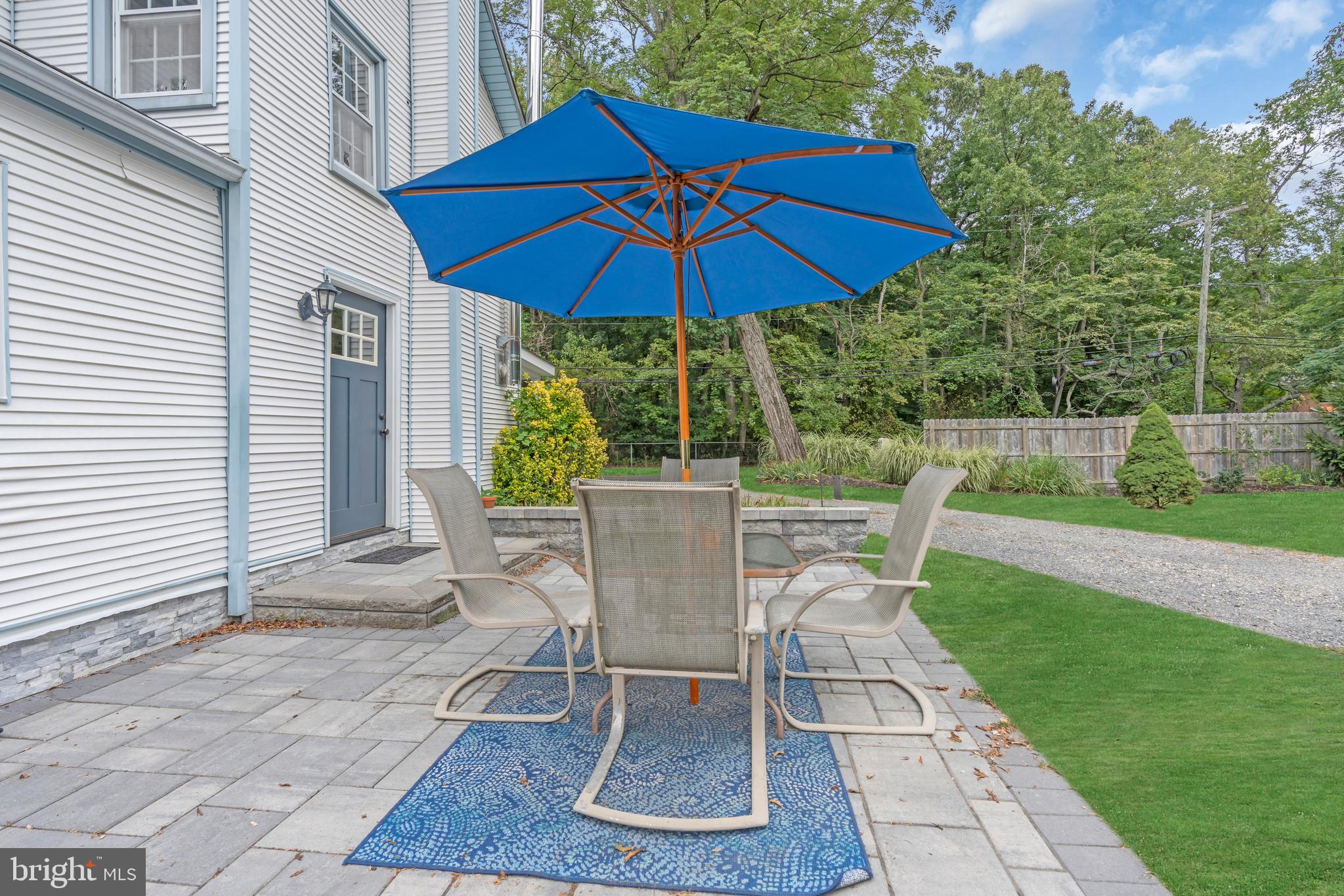 14 Maxim Road Howell, NJ 07731 - Photo 44 of 55 a patio with a table and chairs