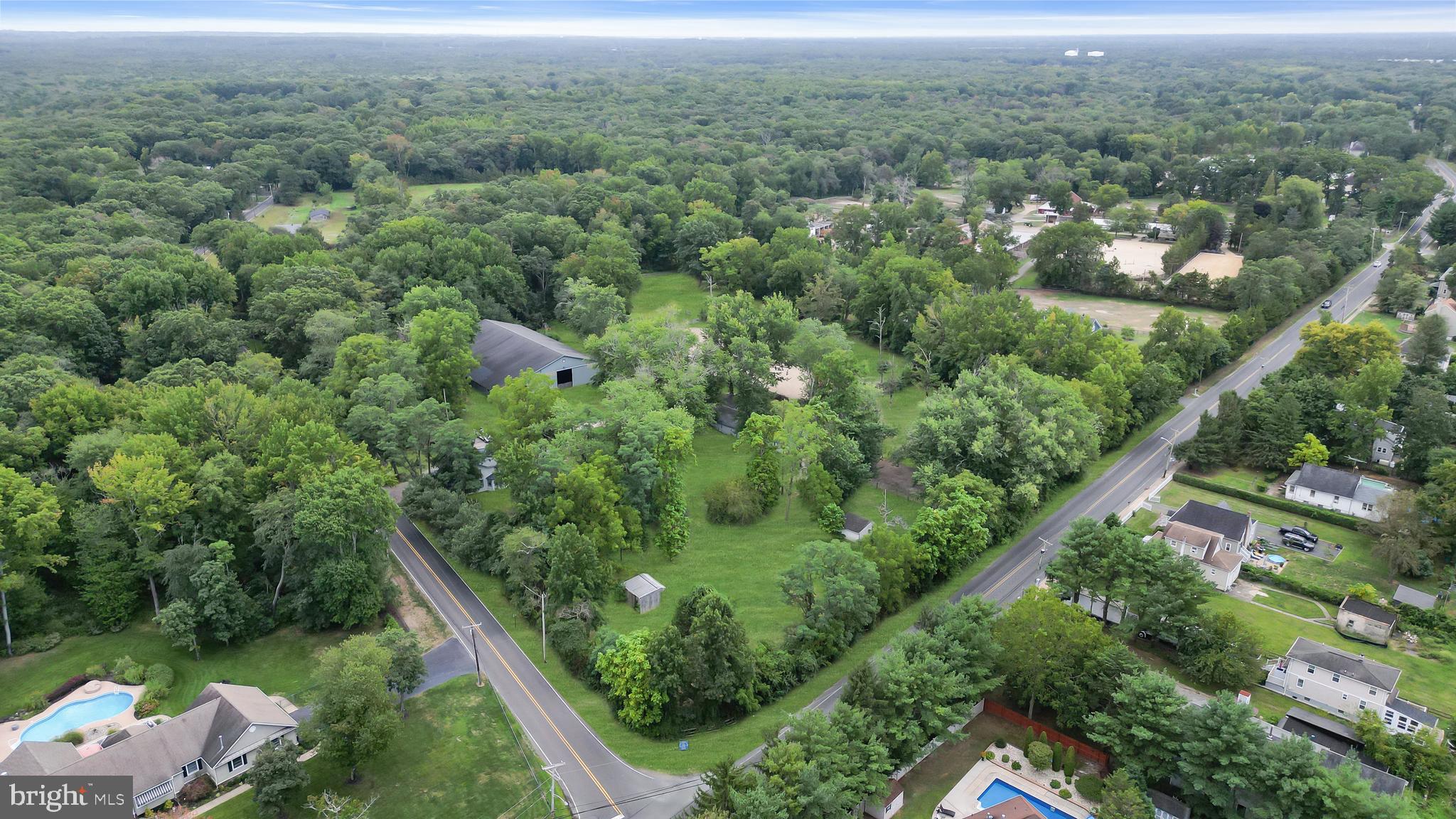 14 Maxim Road Howell, NJ 07731 - Photo 55 of 55 an aerial view of residential houses with outdoor space and trees