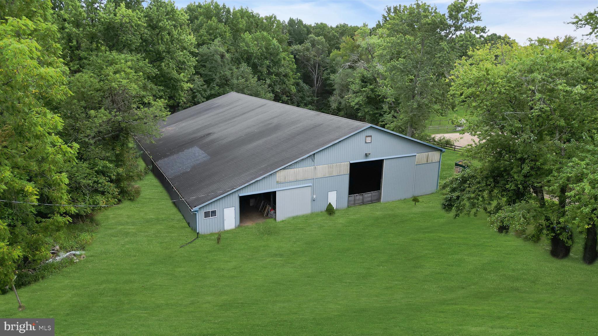 14 Maxim Road Howell, NJ 07731 - Photo 6 of 55 a house with green field in front of it