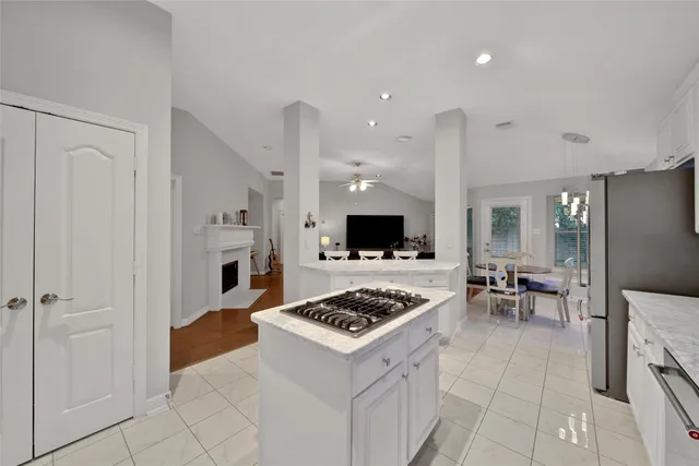 a kitchen with a stove and a refrigerator