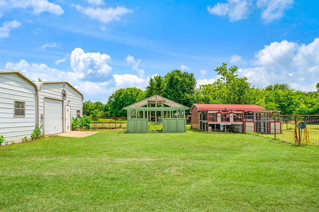 735 1st Southwest Detroit, TX 75436 - Photo 24 of 26 a front view of a house with garden