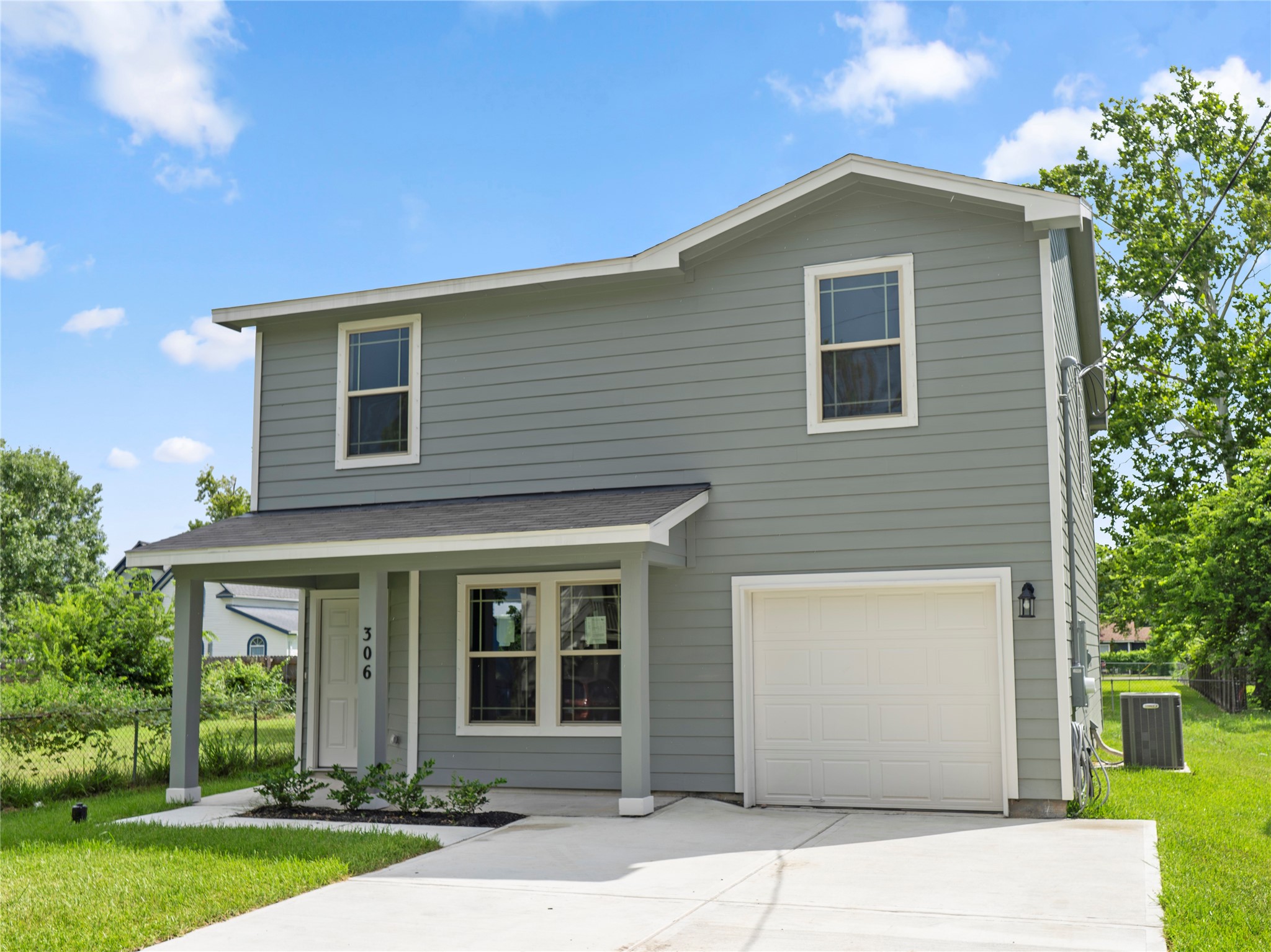front view of a house with a yard