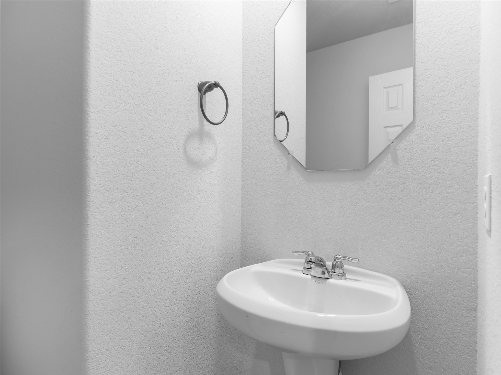 306 North Orange Street Sweeny, TX 77480 - Photo 11 of 30 a bathroom with a sink and a mirror