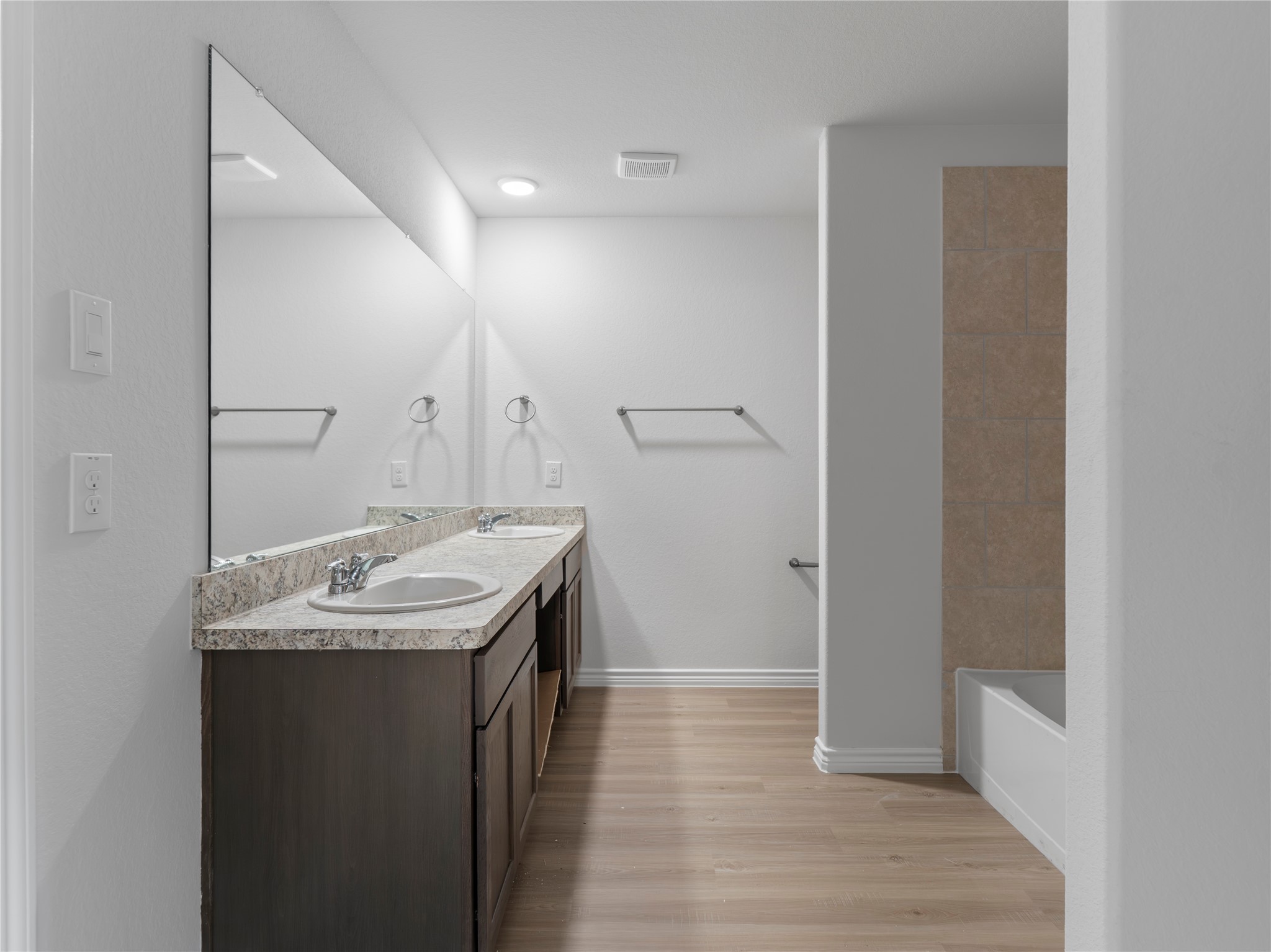 306 North Orange Street Sweeny, TX 77480 - Photo 19 of 30 a bathroom with a sink and a mirror