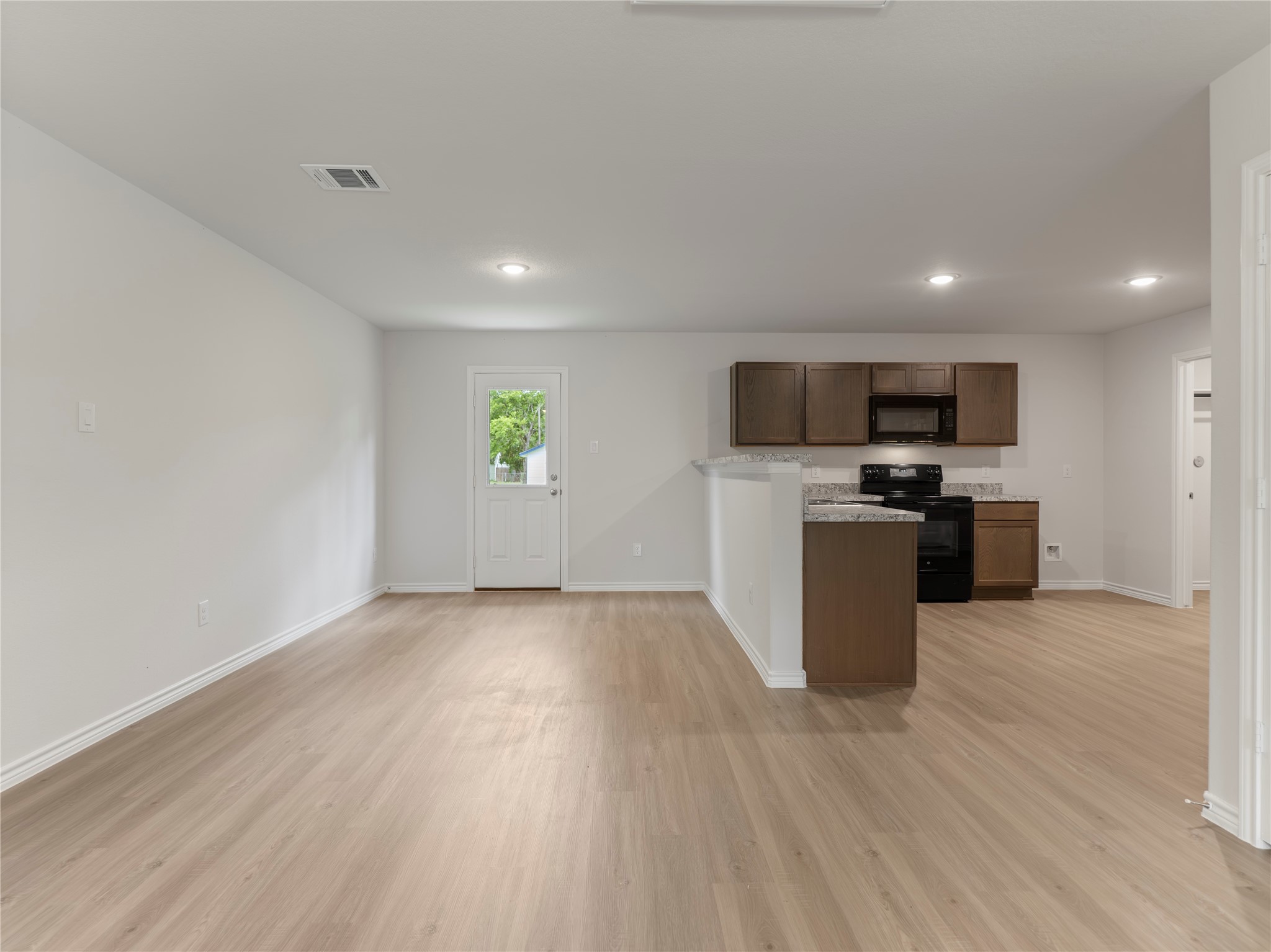 306 North Orange Street Sweeny, TX 77480 - Photo 4 of 30 a view of a electric appliances and wooden floor in a room