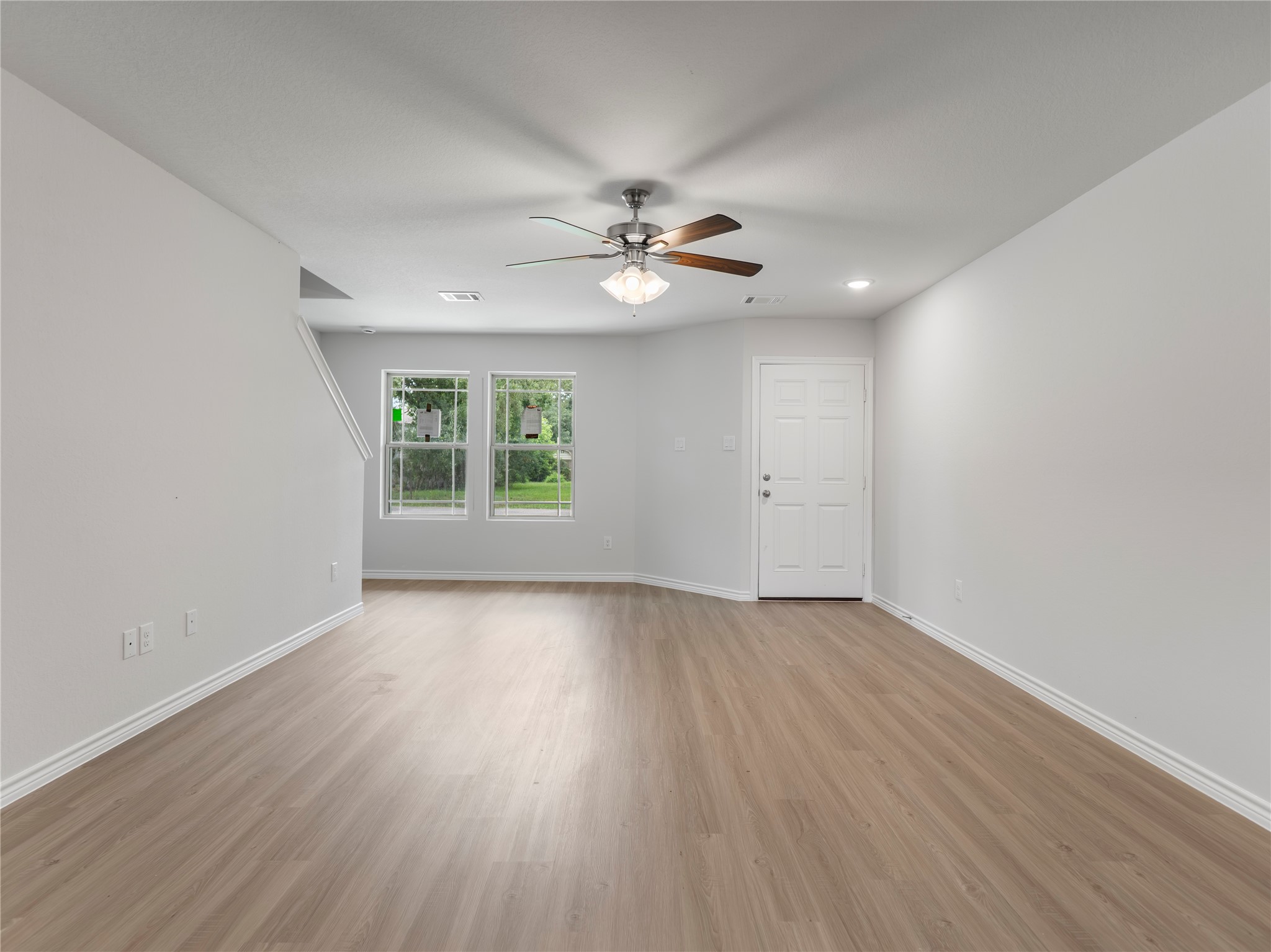 306 North Orange Street Sweeny, TX 77480 - Photo 6 of 30 wooden floor in an empty room with a window