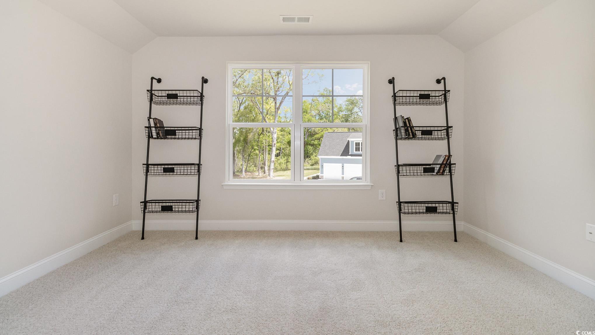 113 Keithland Drive Conway, SC 29527 - Photo 20 of 24 Unfurnished bedroom featuring multiple windows, carpet floors, and vaulted ceiling