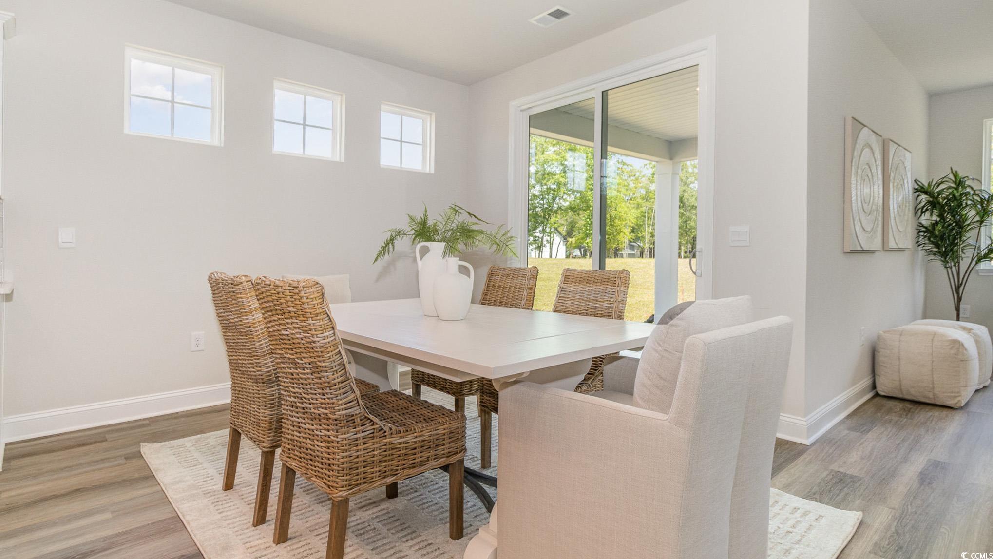 113 Keithland Drive Conway, SC 29527 - Photo 7 of 24 Dining space with light wood finished floors and baseboards